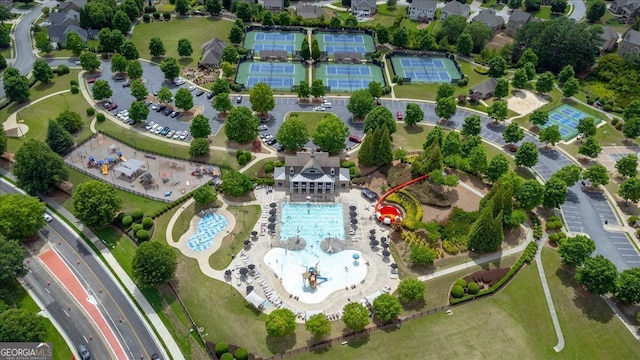 view of property location with a pool area