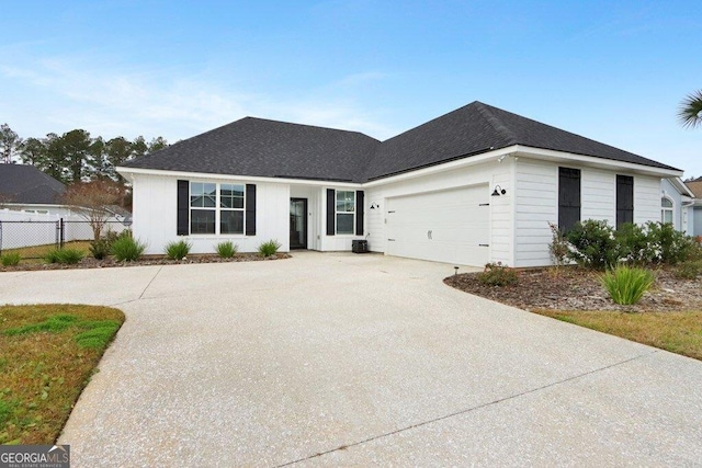 233 Isabella Way, Jesup, GA 31546 - view of front facade featuring fence, concrete driveway, and an attached garage