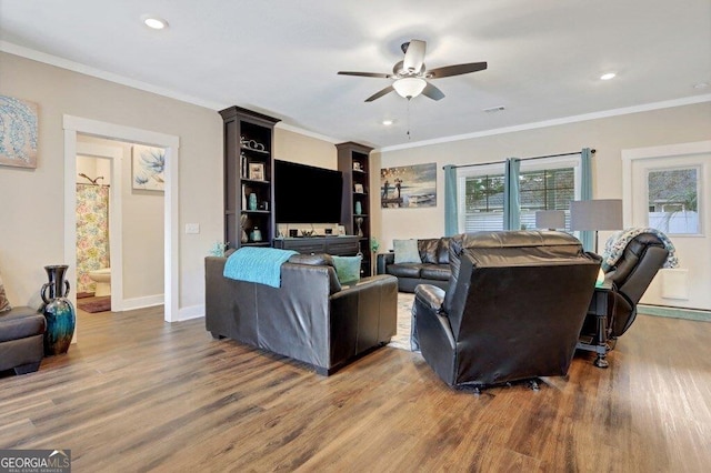 233 Isabella Way, Jesup, GA 31546 - living room featuring wood finished floors, ceiling fan, crown molding, baseboards, and recessed lighting