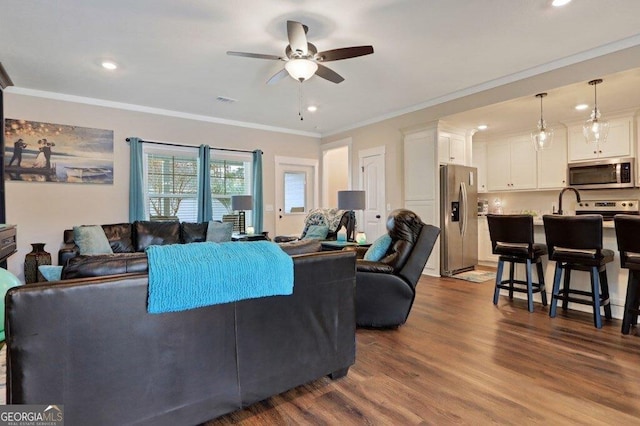 233 Isabella Way, Jesup, GA 31546 - living room featuring ceiling fan, ornamental molding, recessed lighting, and dark wood-type flooring