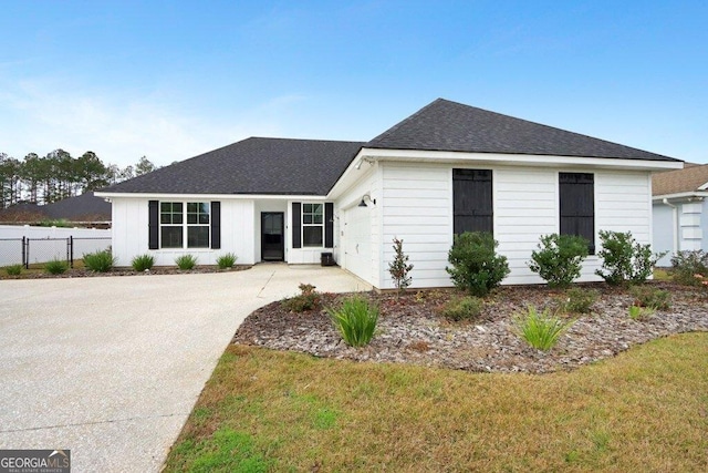 233 Isabella Way, Jesup, GA 31546 - view of front facade featuring roof with shingles, driveway, and an attached garage