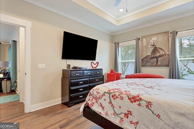 233 Isabella Way, Jesup, GA 31546 - bedroom with multiple windows, wood finished floors, baseboards, crown molding, and a ceiling fan