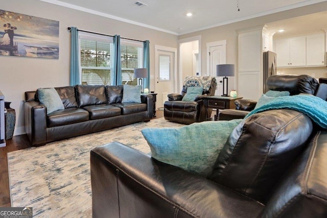 233 Isabella Way, Jesup, GA 31546 - living room featuring wood finished floors, crown molding, and recessed lighting
