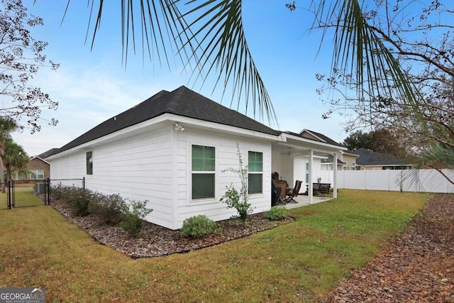 233 Isabella Way, Jesup, GA 31546 - view of side of property featuring a patio, a ceiling fan, a gate, and roof with shingles