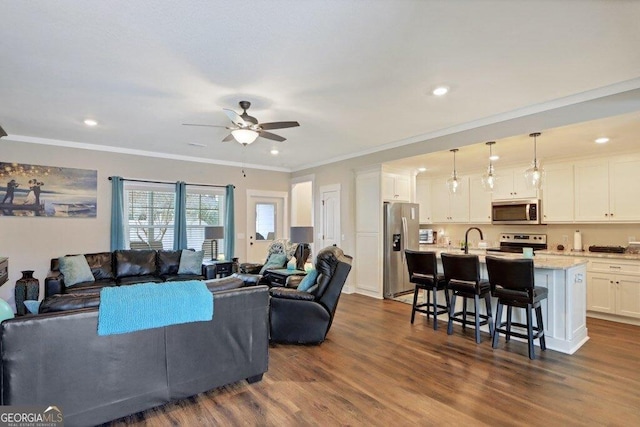 233 Isabella Way, Jesup, GA 31546 - living area featuring a ceiling fan, dark wood finished floors, crown molding, and recessed lighting