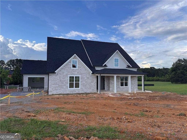126 Telluride Trl NE, Calhoun, GA 30701 - view of front of home featuring stone siding, a porch, and roof with shingles