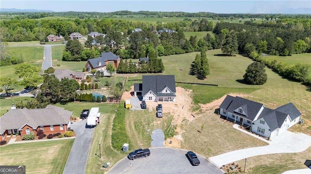 126 Telluride Trl NE, Calhoun, GA 30701 - aerial perspective of suburban area featuring a heavily wooded area