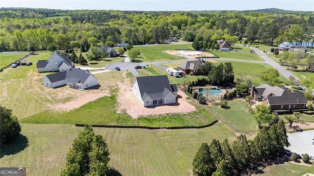 126 Telluride Trl NE, Calhoun, GA 30701 - aerial view of property's location with a forest and a pool area