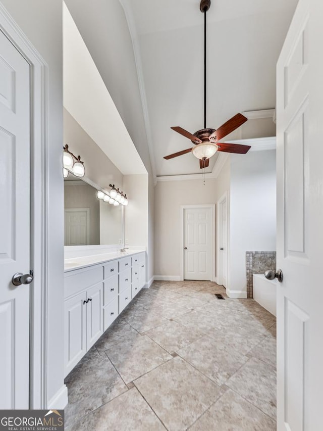 414 Candler Trl, Canton, GA 30115 - bathroom featuring double vanity, ceiling fan, crown molding, lofted ceiling, and tile patterned floors