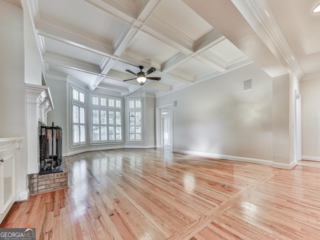 414 Candler Trl, Canton, GA 30115 - unfurnished living room featuring light wood-style floors, a fireplace, a ceiling fan, beam ceiling, and crown molding