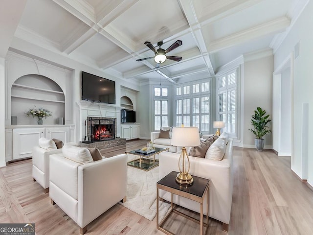 414 Candler Trl, Canton, GA 30115 - living room with a fireplace, ceiling fan, beam ceiling, light wood-style flooring, and built in shelves