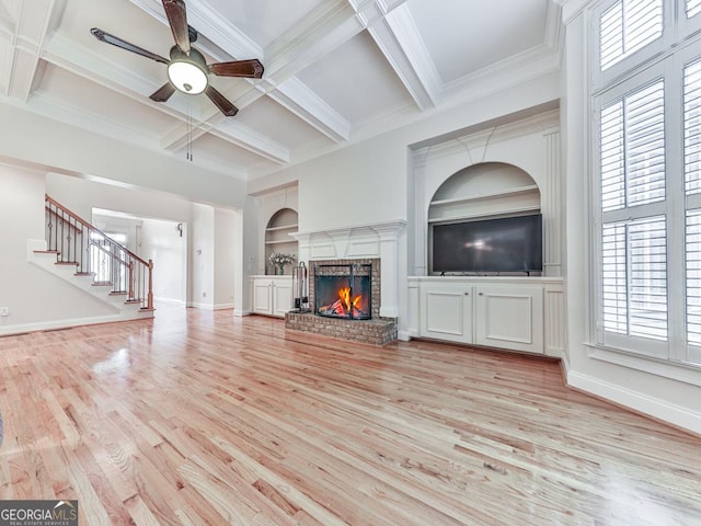 414 Candler Trl, Canton, GA 30115 - unfurnished living room with a ceiling fan, built in features, light wood-type flooring, a fireplace, and beam ceiling