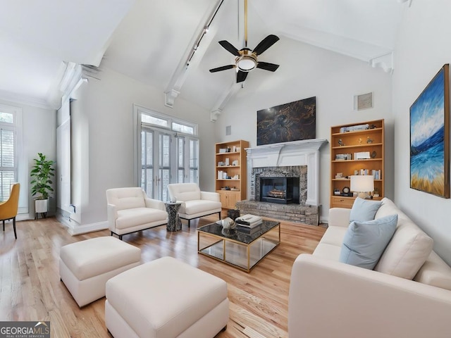 414 Candler Trl, Canton, GA 30115 - living room featuring light wood-style floors, beam ceiling, ceiling fan, a fireplace, and high vaulted ceiling