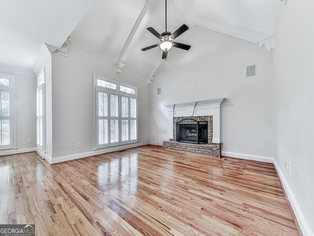 414 Candler Trl, Canton, GA 30115 - unfurnished living room featuring wood finished floors, a brick fireplace, beamed ceiling, ceiling fan, and high vaulted ceiling