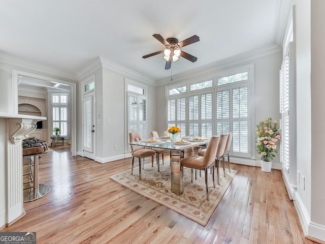 414 Candler Trl, Canton, GA 30115 - dining room featuring light wood finished floors, a ceiling fan, and crown molding