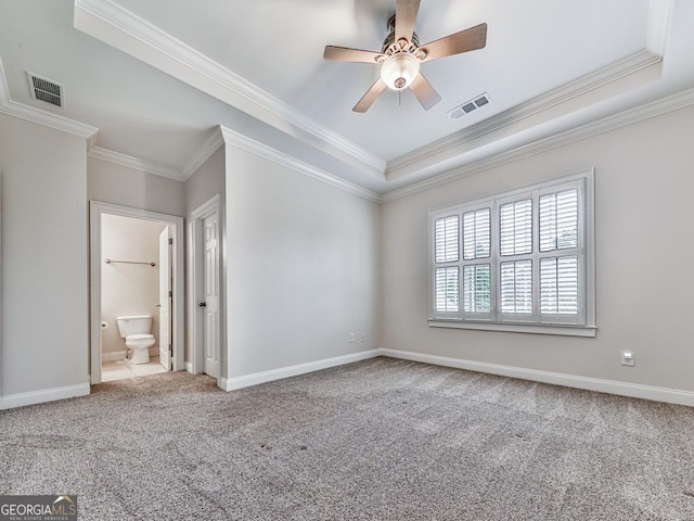 414 Candler Trl, Canton, GA 30115 - unfurnished bedroom featuring ornamental molding, carpet floors, a tray ceiling, a ceiling fan, and ensuite bathroom