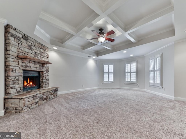 414 Candler Trl, Canton, GA 30115 - unfurnished living room with ornamental molding, a stone fireplace, beam ceiling, carpet, and a ceiling fan