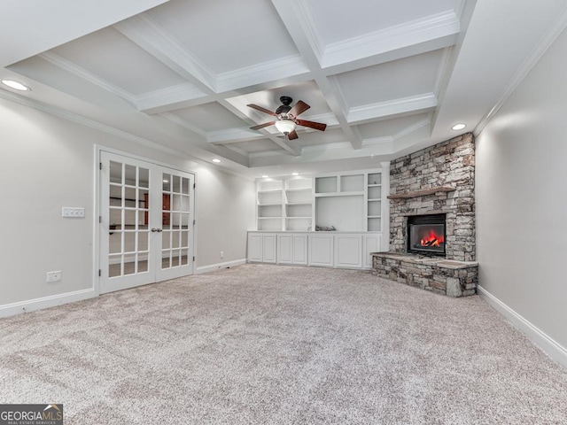 414 Candler Trl, Canton, GA 30115 - unfurnished living room featuring beamed ceiling, french doors, a ceiling fan, carpet floors, and a stone fireplace