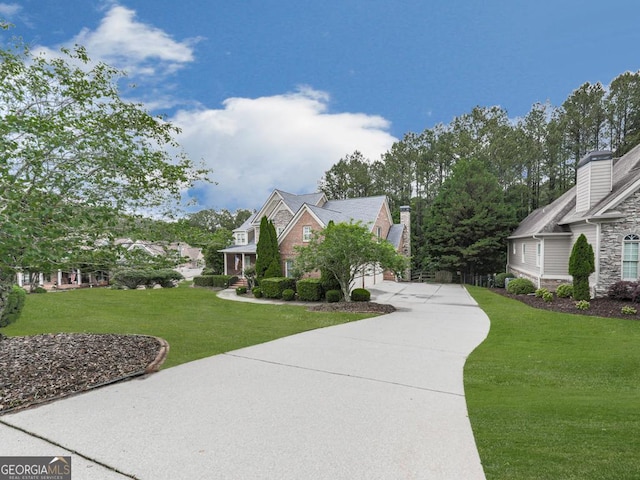 414 Candler Trl, Canton, GA 30115 - view of side of property featuring driveway, stone siding, and a yard