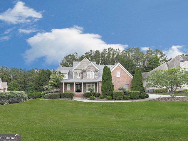 414 Candler Trl, Canton, GA 30115 - craftsman-style house with a front yard, brick siding, and covered porch