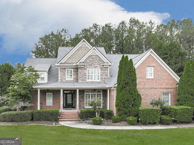 414 Candler Trl, Canton, GA 30115 - view of front of home featuring a front lawn, a porch, and stone siding