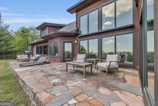 view of patio featuring fence and an outdoor living space