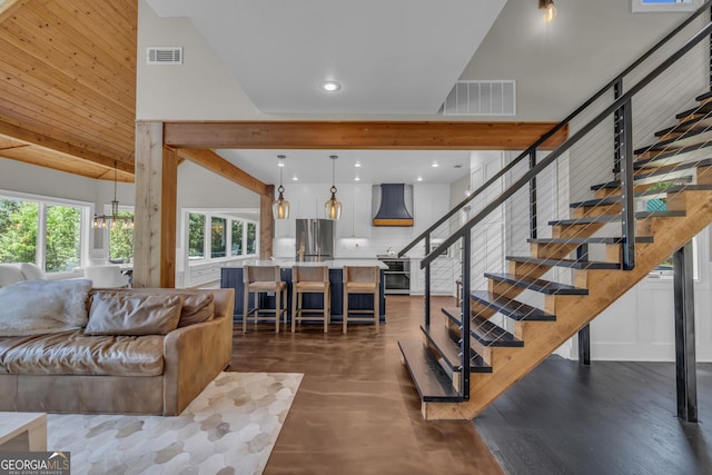 living room with stairway, dark wood-style floors, and recessed lighting