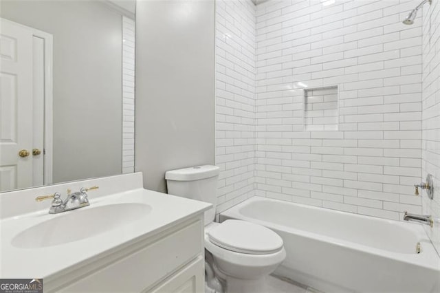 bathroom featuring toilet, vanity, and shower / bath combination
