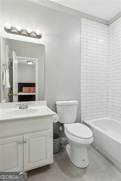 full bath featuring tile patterned flooring, toilet, vanity, ornamental molding, and shower / washtub combination