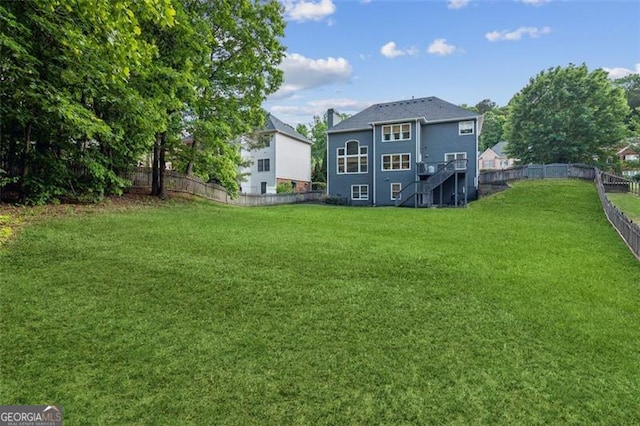 rear view of property with stairs
