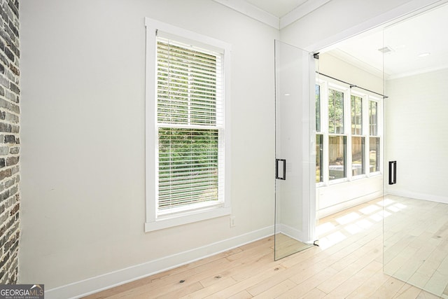 4276 Lindsey Way NE, Roswell, GA 30075 - unfurnished room featuring crown molding, baseboards, and wood finished floors