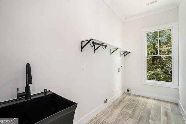 4276 Lindsey Way NE, Roswell, GA 30075 - washroom featuring ornamental molding, light wood finished floors, baseboards, and washer hookup