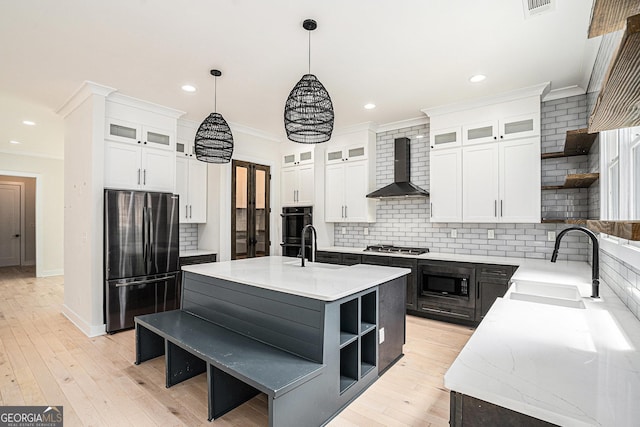 4276 Lindsey Way NE, Roswell, GA 30075 - kitchen featuring open shelves, appliances with stainless steel finishes, wall chimney exhaust hood, a sink, and crown molding