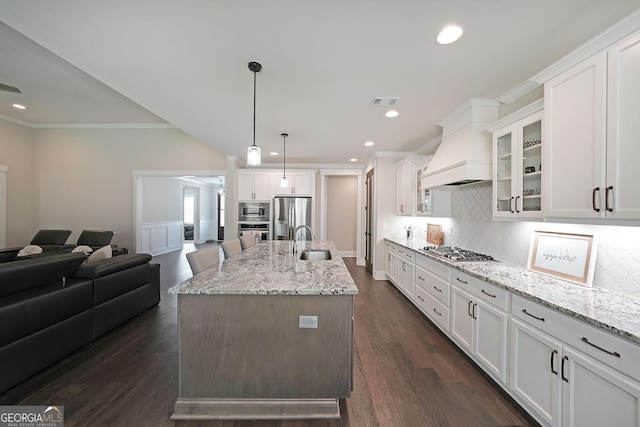 485 Discovery Lake Dr, Fayetteville, GA 30215 - kitchen featuring stainless steel appliances, a sink, custom exhaust hood, open floor plan, and crown molding