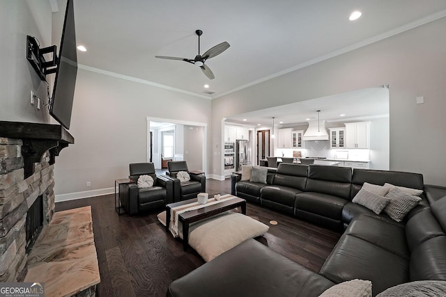 485 Discovery Lake Dr, Fayetteville, GA 30215 - living area with a ceiling fan, recessed lighting, dark wood-style flooring, a stone fireplace, and ornamental molding