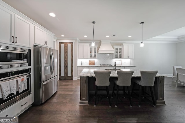 485 Discovery Lake Dr, Fayetteville, GA 30215 - kitchen featuring stainless steel appliances, premium range hood, a sink, ornamental molding, and tasteful backsplash