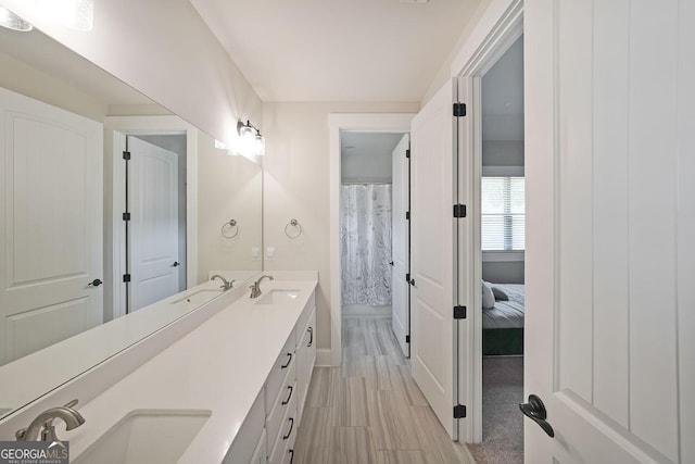485 Discovery Lake Dr, Fayetteville, GA 30215 - full bathroom featuring double vanity, baseboards, and wood finished floors