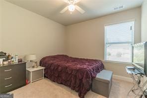 bedroom with light carpet, baseboards, and ceiling fan