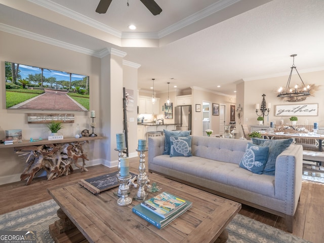 137 Ryan Nicholas Dr, Kingsland, GA 31548 - living room with hardwood / wood-style floors, recessed lighting, ornamental molding, a ceiling fan, and baseboards