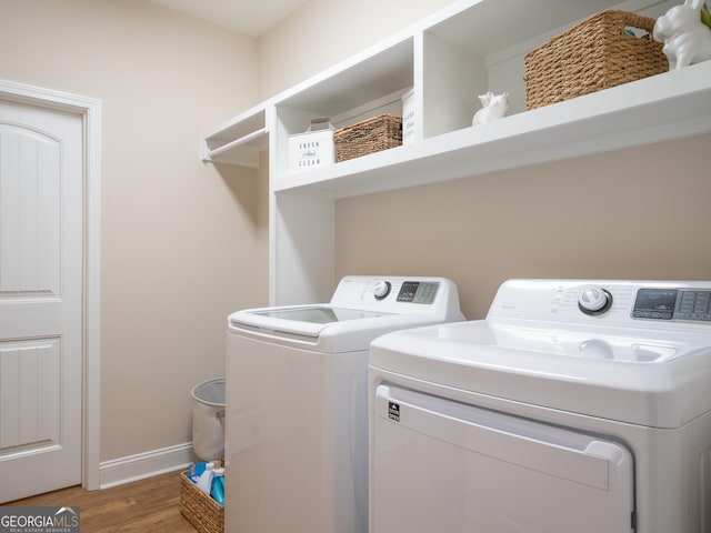 137 Ryan Nicholas Dr, Kingsland, GA 31548 - laundry room with separate washer and dryer, wood finished floors, and baseboards