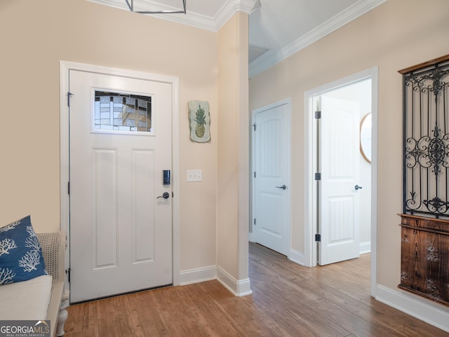 137 Ryan Nicholas Dr, Kingsland, GA 31548 - foyer entrance with crown molding, wood finished floors, and baseboards