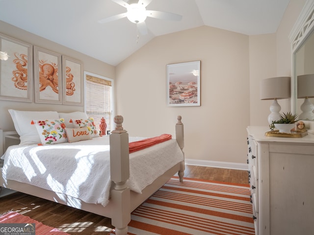 137 Ryan Nicholas Dr, Kingsland, GA 31548 - bedroom featuring dark wood-type flooring, vaulted ceiling, baseboards, and ceiling fan