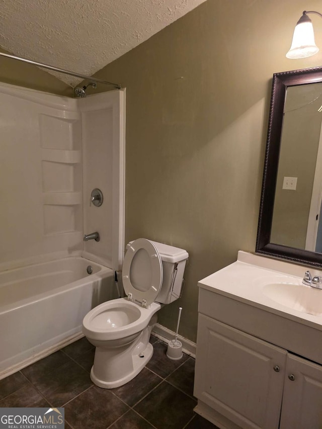 full bath featuring tile patterned floors, a textured ceiling, shower / tub combination, toilet, and vanity