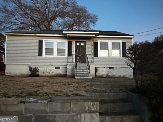 view of front of house with crawl space