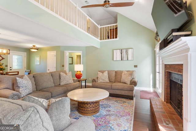 836 Palmetto Tyrone Rd, Sharpsburg, GA 30277 - living room featuring high vaulted ceiling, baseboards, a fireplace, wood finished floors, and ceiling fan
