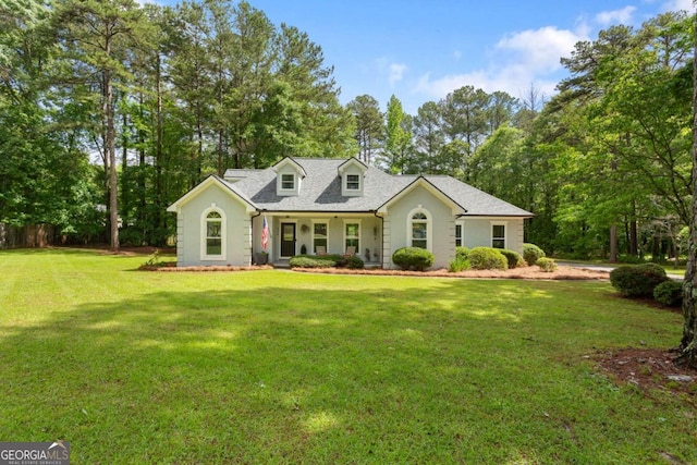 836 Palmetto Tyrone Rd, Sharpsburg, GA 30277 - cape cod house with a front yard, view of wooded area, and roof with shingles
