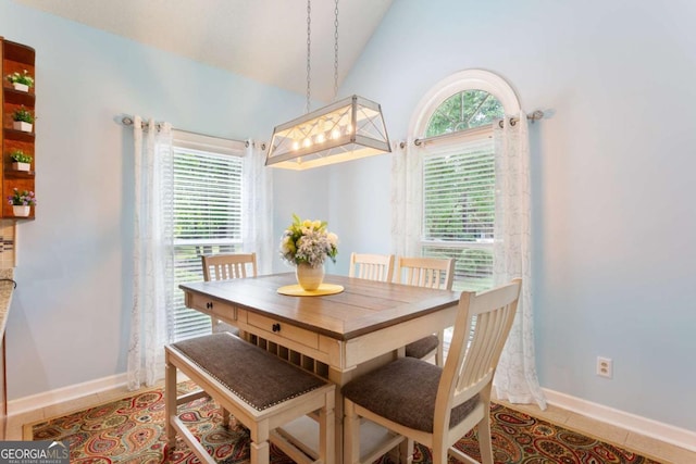 836 Palmetto Tyrone Rd, Sharpsburg, GA 30277 - dining space featuring plenty of natural light, vaulted ceiling, baseboards, and light tile patterned floors