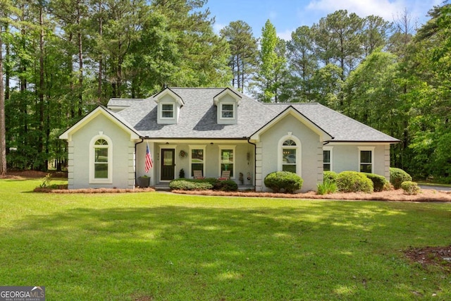 836 Palmetto Tyrone Rd, Sharpsburg, GA 30277 - cape cod house with a front lawn, covered porch, and a shingled roof