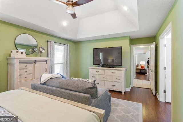 836 Palmetto Tyrone Rd, Sharpsburg, GA 30277 - bedroom with dark wood-style flooring, a raised ceiling, and a ceiling fan