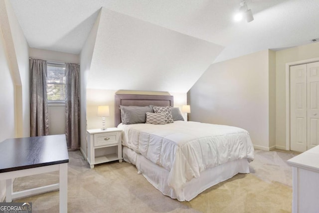 836 Palmetto Tyrone Rd, Sharpsburg, GA 30277 - bedroom featuring light colored carpet, a closet, lofted ceiling, and a ceiling fan